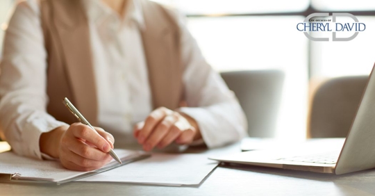 person signing a document