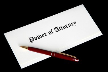 A white document labeled “Power of Attorney”.